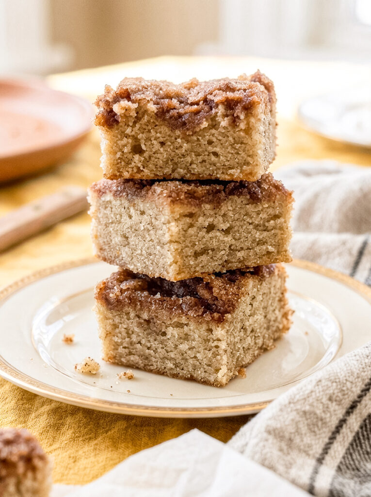 Banana snickerdoodle bars stacked on a plate.