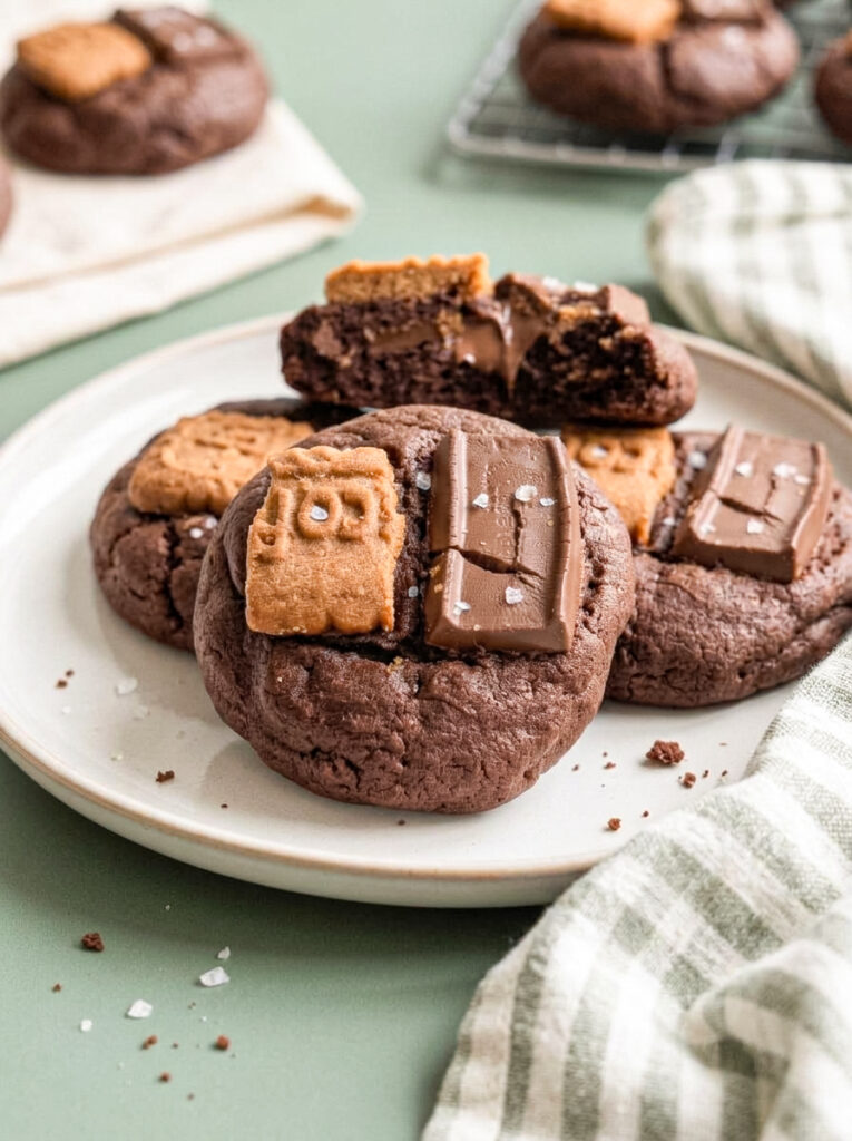 Double chocolate biscoff cookies topped with biscuit and chocolate pieces.