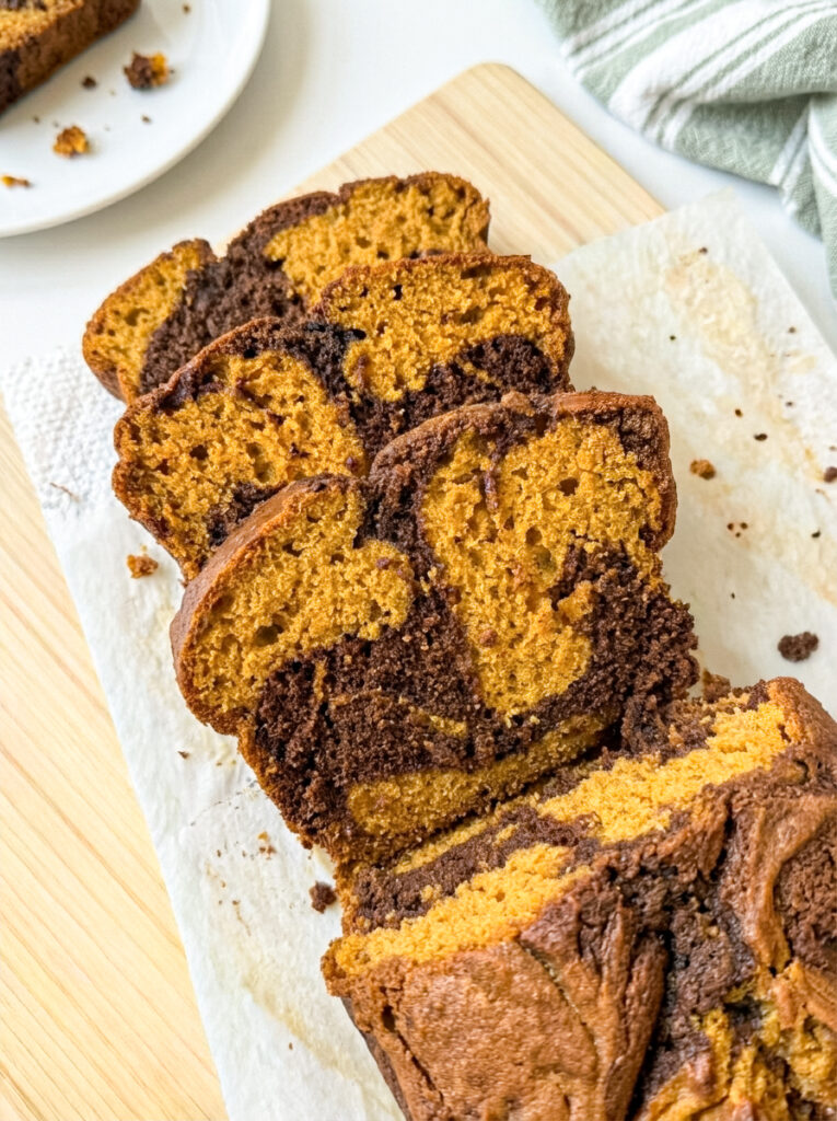 Pumpkin Nutella swirl loaf slices showing dark chocolate swirls on parchment